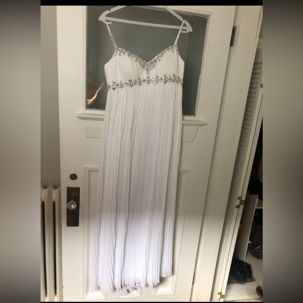 Light and flowy wedding dressing with sequin bodice.